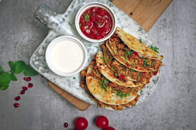 Quick chicken quesadillas with melted cheese and salsa
