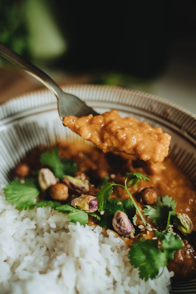 Warm chickpea coconut curry in bowl with rice - 25-minute vegetarian meal