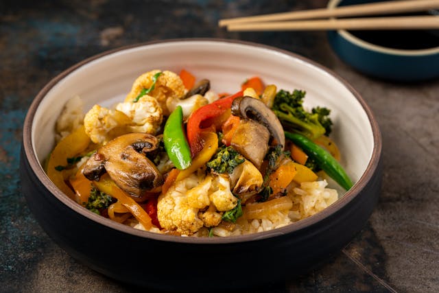 Quick honey garlic chicken stir-fry with vegetables and rice