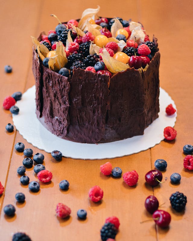 Homemade chocolate cake with fresh berries on top