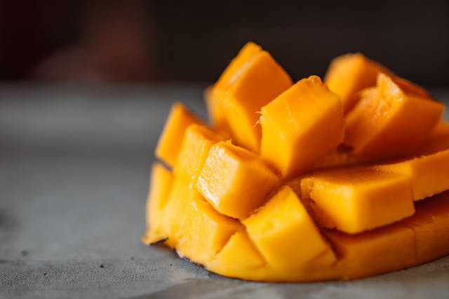 Frozen mango cubes in a bowl for mango lassi recipe