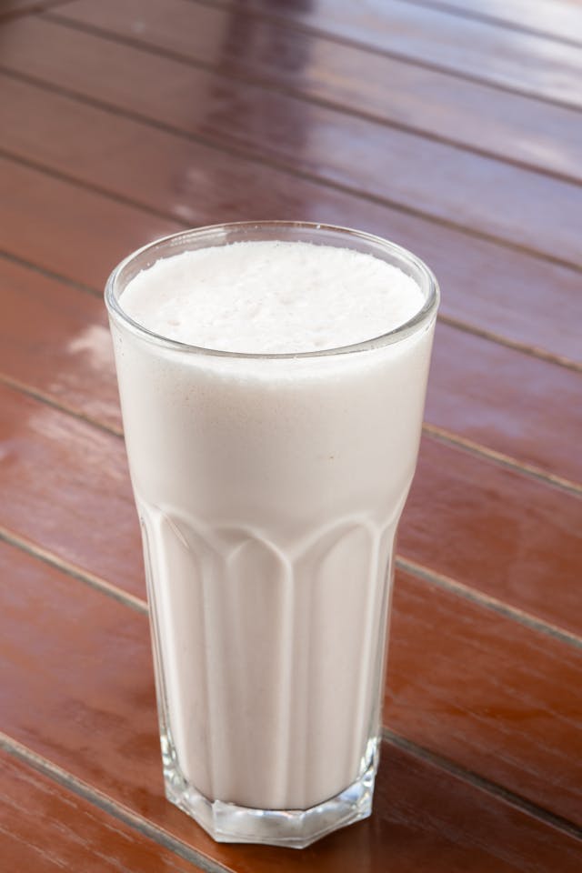 Namkeen Lassi served in tall glasses with ice cubes and mint garnish