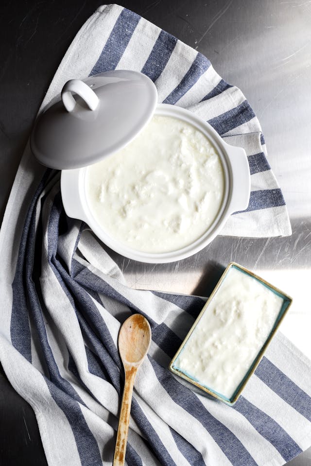 Fresh creamy yogurt in bowl for authentic Punjabi Namkeen Lassi