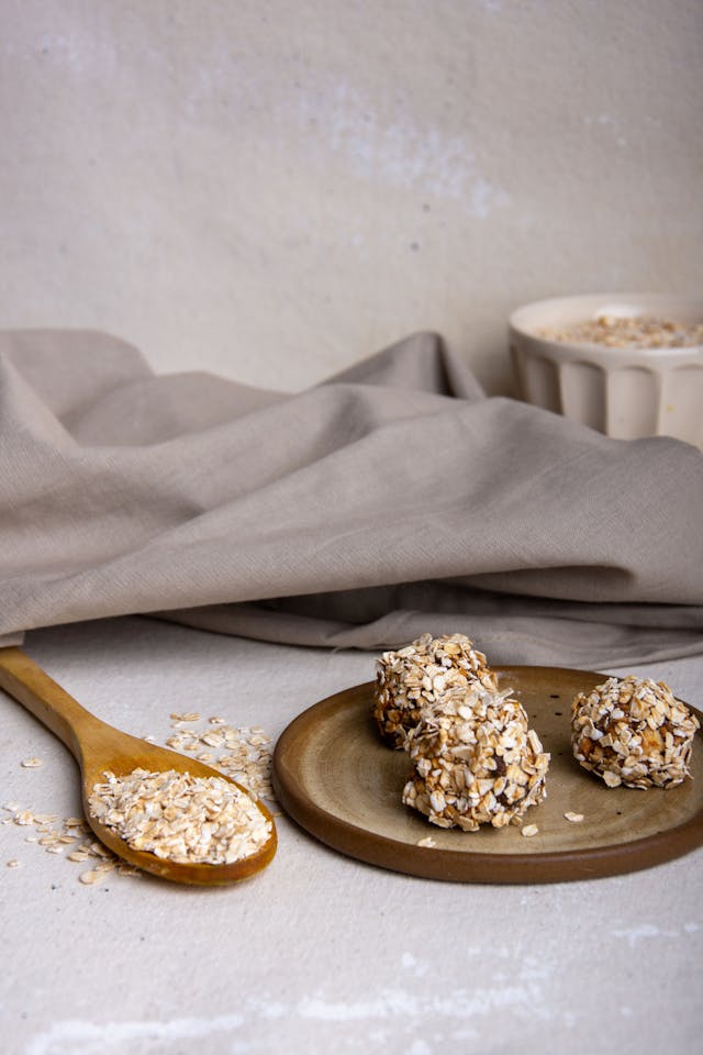 No-bake oatmeal energy bites stacked on white plate - healthy school lunchbox dessert for kids