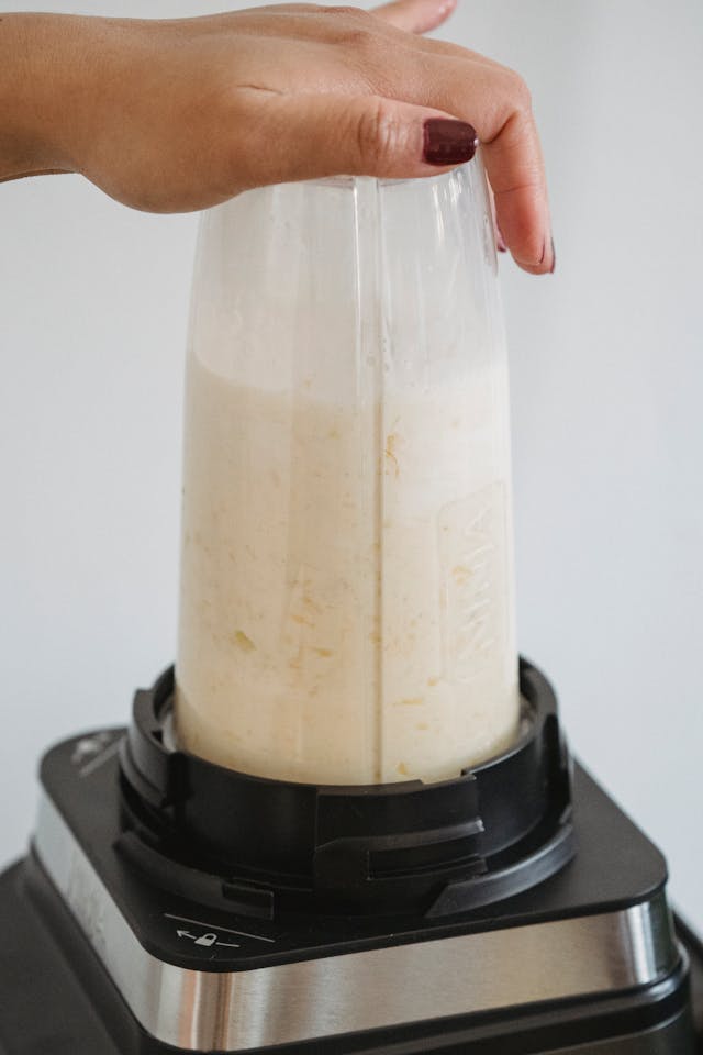 blending sweet lassi in a blender until smooth and frothy