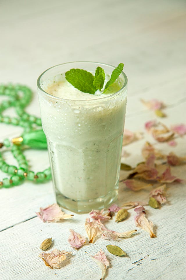 sweet lassi served chilled in a glass with garnish