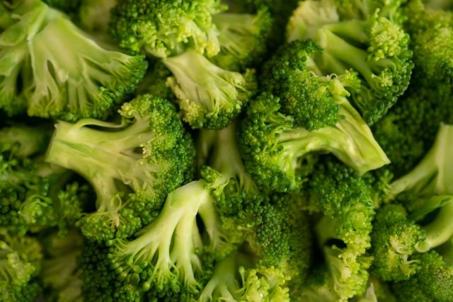 Fresh broccoli florets chopped into small pieces for broccoli cheddar soup